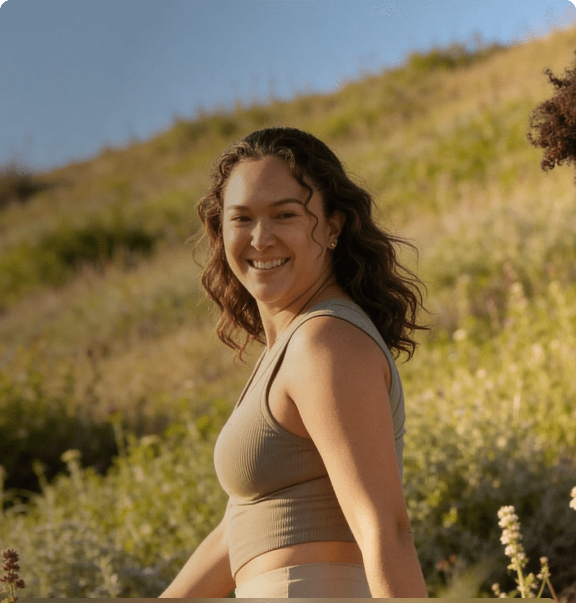 Women walking outdoors in a sunlit field
